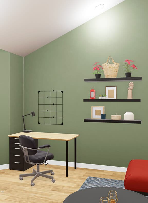 A virtual holiday-themed living space in IKEA Kreativ with green walls, a red sectional sofa, a desk area, and a Christmas tree. Black accents and festive décor create a cozy, modern setting for both work and celebration.