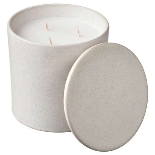 A white, speckled, cylindrical candle with three wicks and a matching lid, crafted from ceramic.