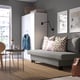 Modern living room with ÄLVDALEN sofa, decor. Grey sofa, patterned pillows, basket. Cosy, contemporary feel.