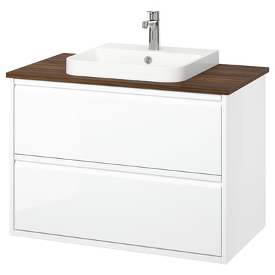 Displays a white ÄNGSJÖN bathroom vanity with a wood countertop, featuring drawers and a square sink.
