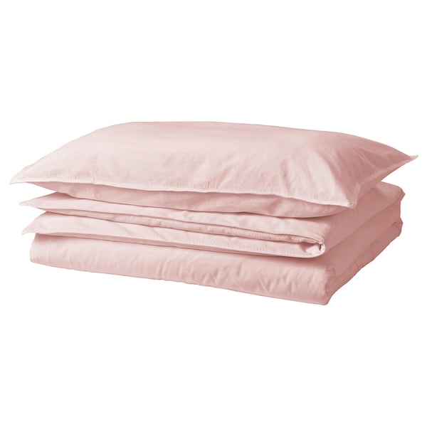 Pink cotton bedding set with folded duvet cover and pillows.