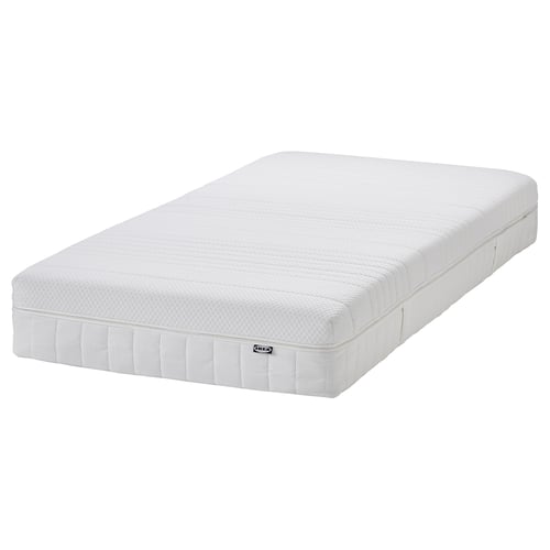 White IKEA ÅNNELAND hybrid mattress with memory foam, plush foam, and pocket springs. Rectangular, medium-firm, and 24 cm high.