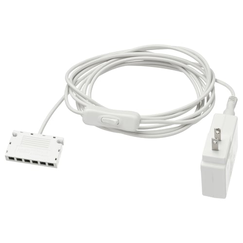 Image ANSLUTA power adapter. Its white, rectangular with cables, designed to control multiple lights with one switch.