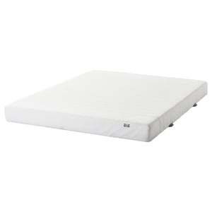 White IKEA foam mattress, rectangular, with soft zippered cover.