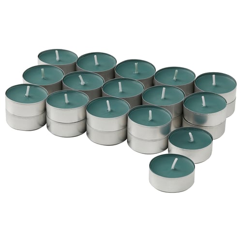 A collection of green minty scented candles in silver holders, arranged in a circle.