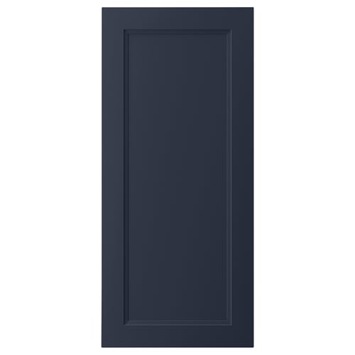 A dark blue AXSTAD kitchen cabinet door with a smooth, recessed panel design, made from fiberboard and melamine laminate.