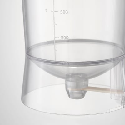 Clear plastic measuring jug with marked measurements up to 500 ml, featuring a spout and a handle.