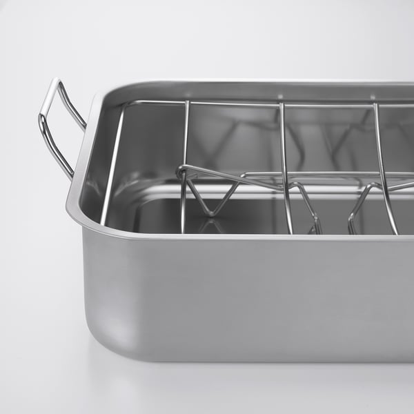 Stainless-steel roasting tin with rack. Sturdy handles, ideal for oven or grill.
