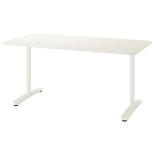 A white BEKANT desk with a rectangular top and adjustable legs.