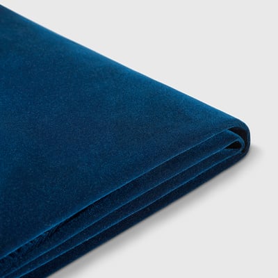 Deep blue velvet cover, texture smooth, folded neatly, elegant quality.