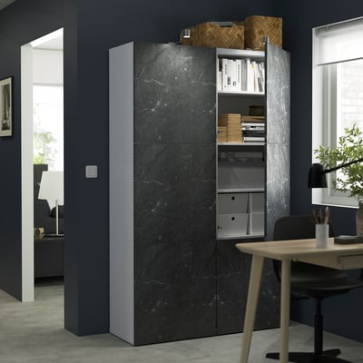 Grey BESTÅ shelves with books & basket, beside desk and chair