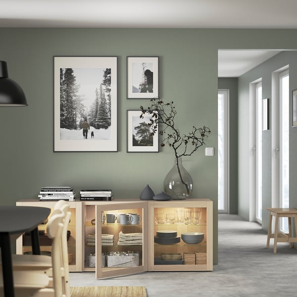 BESTÅ Storage combination with doors, white stained oak effect/Sindvik wht stained oak effect clear glass, 70 7/8x16 1/2x25 5/8 "
