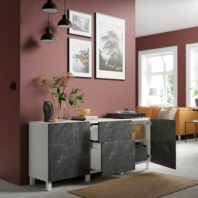 Alt: modern sideboard with dark marble, open drawers, plant, art, pendants, and orange sofa.