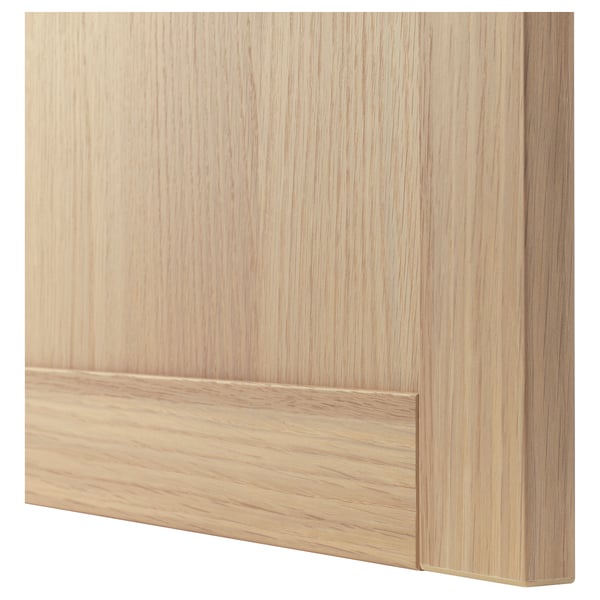 Wooden light oak drawer front, smooth grain.