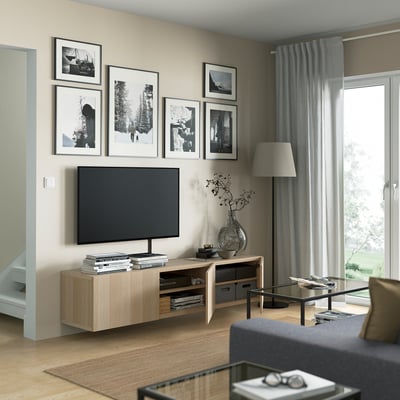 Modern living room with a wall-mounted tv bench, featuring adjustable shelves, cable management, and a sleek, organised look.