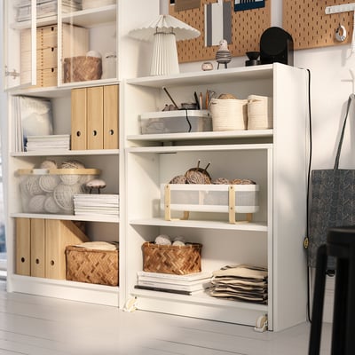 Shelving unit with open and closed storage, baskets, trays, and tabletop.