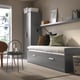 Grey BRIMNES daybed with 2 drawers, converts to single/double bed, minimalist room with modern decor.