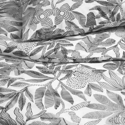 Botanical duvet cover with intricate, embroidery-like floral patterns on soft, smooth fabric.