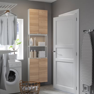 ENHET oak & white storage unit with cabinets and shelves for laundry room.