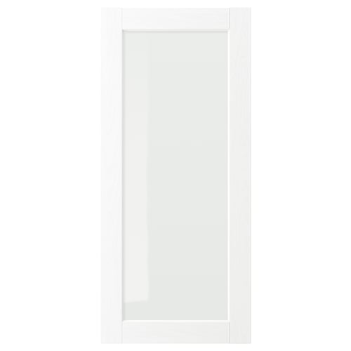 White ENKÖPING cabinet door with clear glass and subtle wood grain.