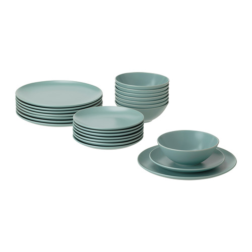A set of light green FÄRGKLAR dinnerware. Includes plates and bowls, all stoneware, round and simple design.