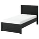 A FÅGELFJÄLLET black oak bed with a white mattress, featuring a simple, elegant design and a slightly wider footboard.