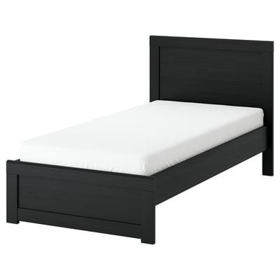 A FÅGELFJÄLLET black oak bed with a white mattress, featuring a simple, elegant design and a slightly wider footboard.
