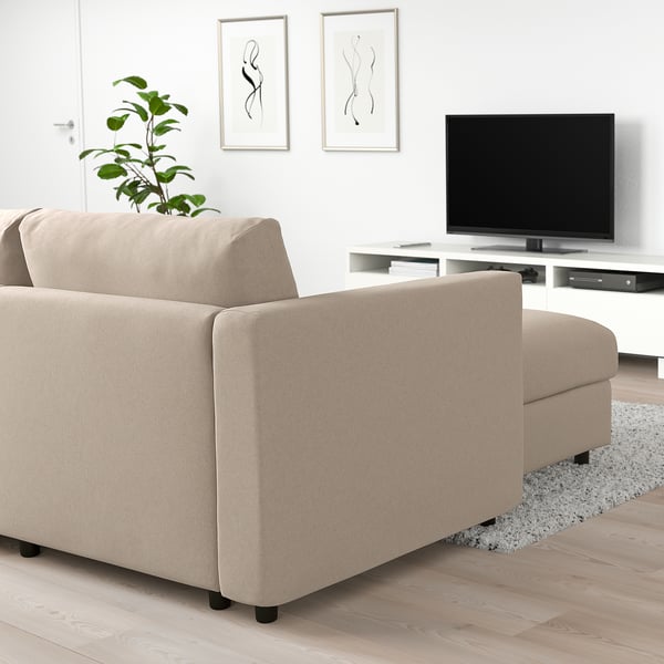FINNALA sofa, beige, modern, l-shaped, includes tv & plant, fits living room.