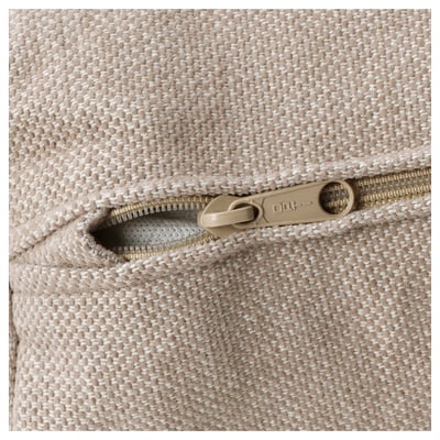 A zip detail on a beige woven sofa section, highlighting quality craftsmanship with a robust zip and durable fabric.