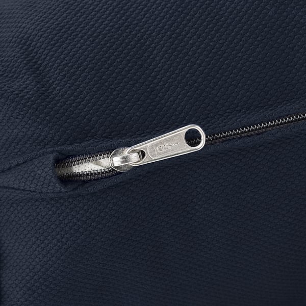 Close-up of zip on grey fabric, showcasing quality and durability.