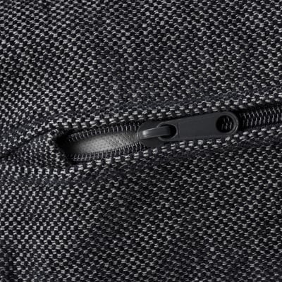 Close-up of durable, textured fabric zip, showing high-quality stitching and smooth operation.