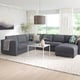 Modern living room: large grey FINNALA sectional sofa, white coffee table, large window with curtains.