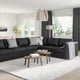 Modern living room: FINNALA sofa, two coffee tables, rug, large window, pendant light.