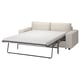 A light-colored FINNALA sofa-bed with a modern design, featuring a sleek metal frame and soft, removable covers.