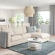 Modern living room with beige FINNALA sectional sofa, removable cushions, under pendant light, white side table, blue rug, grey curtains.