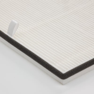 Close-up of a white air philtre with textured surface and black border, showing quality design and material.