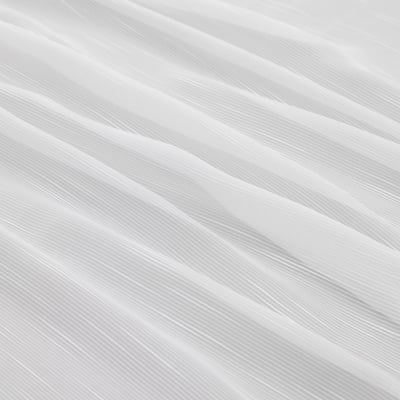 Sheer, recycled polyester curtains, offering privacy and natural light. Diagonal lines create a modern pattern.