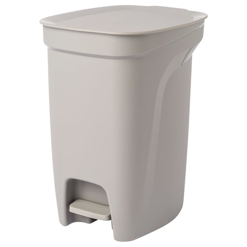 A HÄCKSAX pedal bin in beige with a handle, made of plastic, for kitchen use.