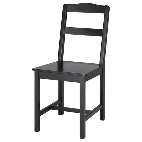 A HÄGERNÄS black wooden chair with a classic design, made from solid pine, and featuring a backrest with vertical slats.