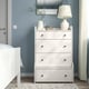 Modern bedroom with HAUGA white chest & drawers, lamp, & mirror. Compact yet spacious, fits neatly beside the bed.