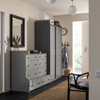Modern entryway with HAUGA dresser and wardrobe, mirror, coat stand, door and light.