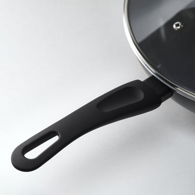 Black wok handle, securely attached, sleek and ergonomic design, heat resistant and durable for safe cooking.