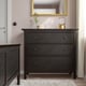 Dark wood HEMNES 3-drawer chest, sleek & sturdy, fits well in cosy rooms, with smooth drawers & a stylish lamp on top.