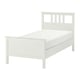 White HEMNES wooden bed with rectangular headboard and clean lines.