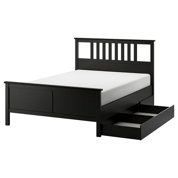 Black HEMNES wooden bed with drawers & white mattress.