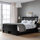 Bedroom with HEMNES black bed. Bed has four large drawers, grey and blue bedding, two nightstands with lamps. Big window with curtains.