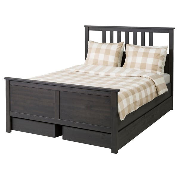 HEMNES dark grey wooden bed with chequered bedding.