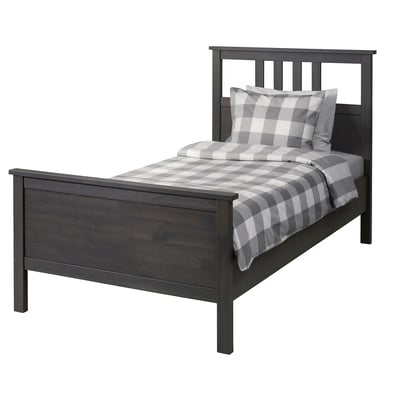 Dark grey HEMNES solid wood bed with grey checked bedding.