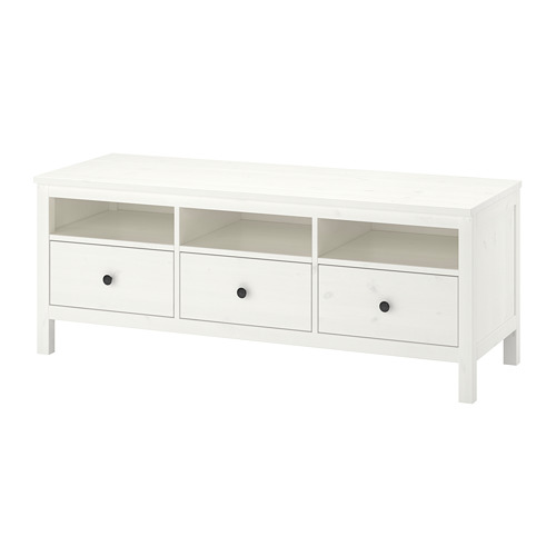 A white wooden tv stand named HEMNES. Its rectangular, featuring drawers and open shelves.