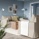 Modern living room with HYLTARP sofa, light beige, large, comfortable, against blue wall.